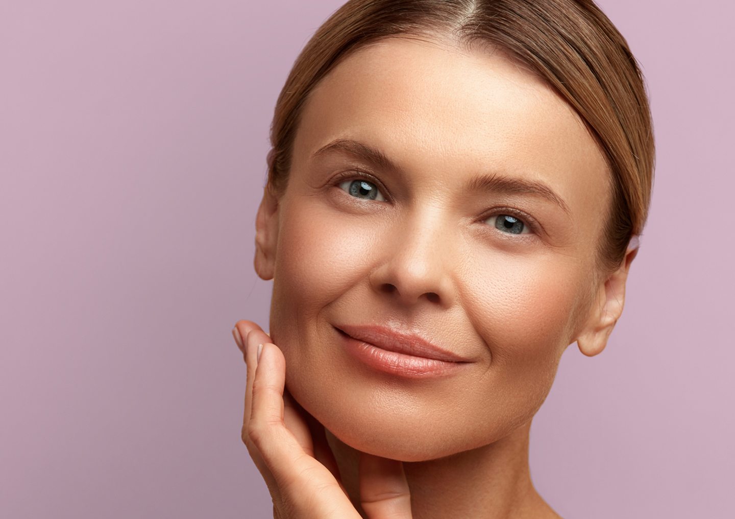Woman with smooth, youthful skin after a CoolPeel laser treatment at Chapter Aesthetic Studio, targeting fine lines and sun damage for skin rejuvenation.