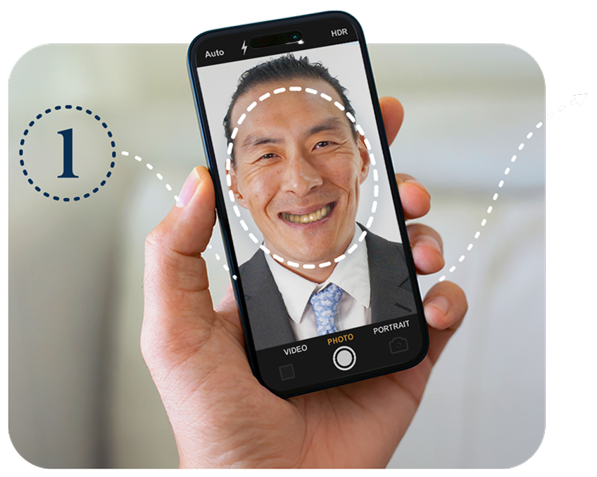 Hand holding a smartphone showing a man’s face outlined for upload, illustrating Step 1 of the ClearChoice First Look app photo process.