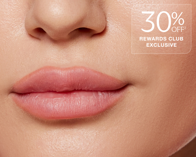 A close up of a woman's lips after receiving filler treatment, with text overlaid which reads "30% off rewards club exclusive"