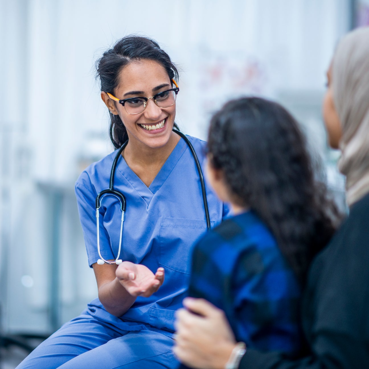Provider talking to a parent and child.