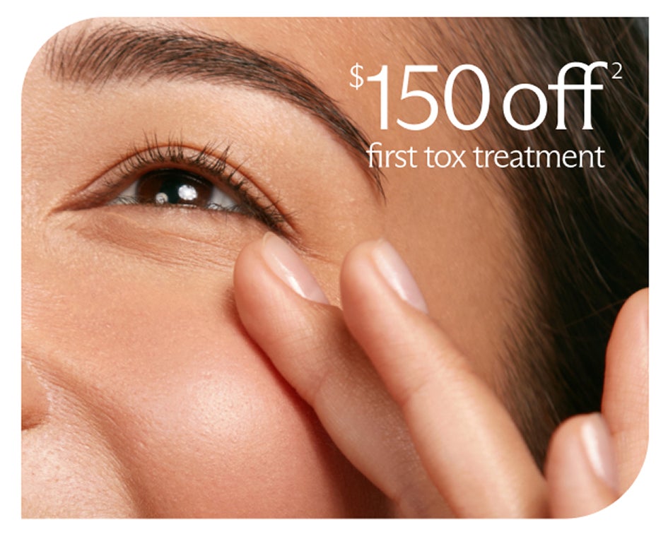 Close-up of an eye and hand, advertising $150 off a first tox treatment