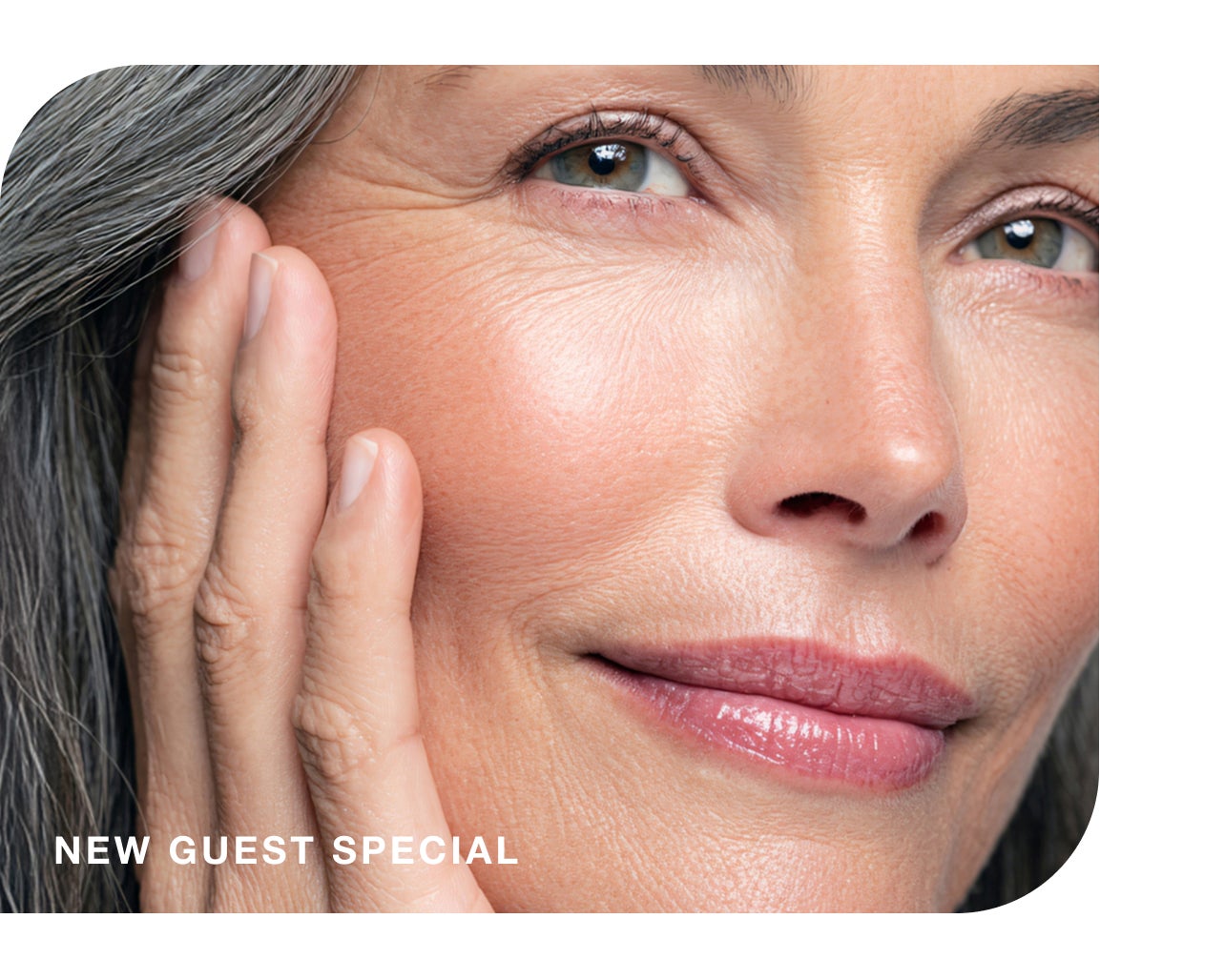 Radiant woman with a gentle smile, highlighting a "new guest special."