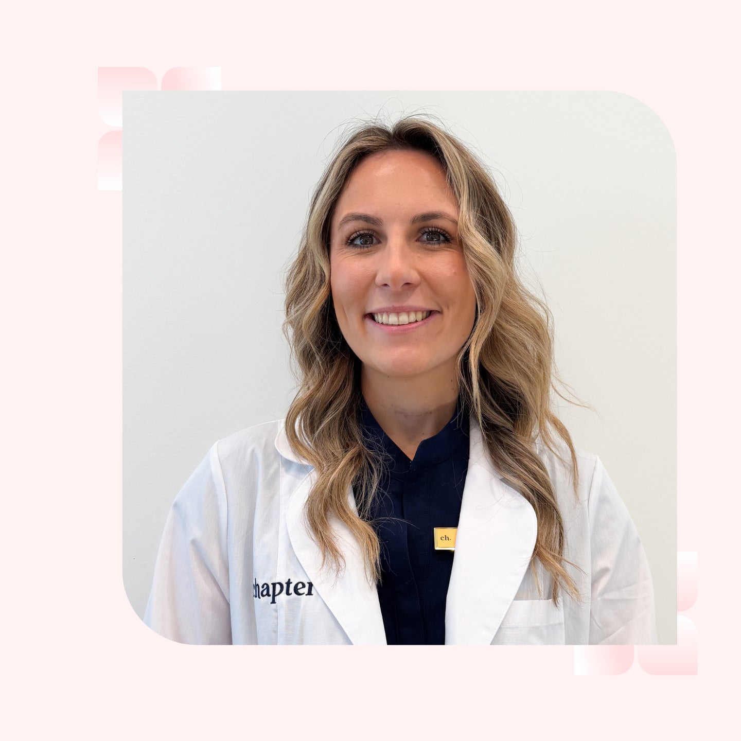 A woman with wavy blonde and brown hair