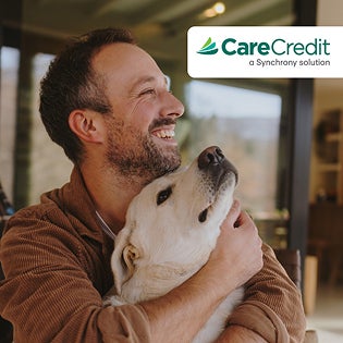CareCredit graphic with man hugging his dog.