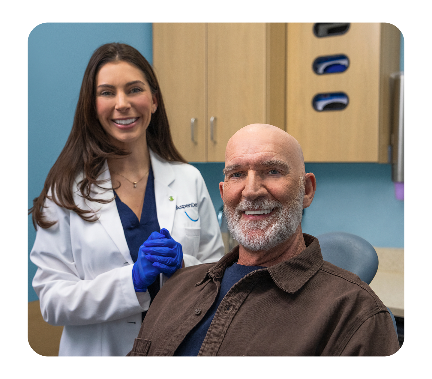  Aspen Dental dentist with happy patient in the exam room.