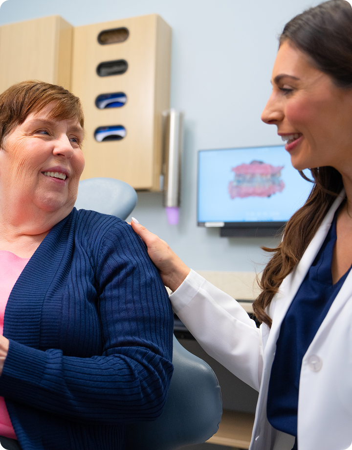 A healthcare professional offering compassionate reassurance to a patient