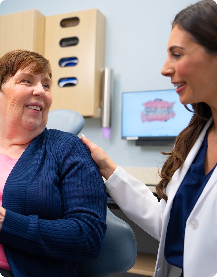 A healthcare professional offering compassionate reassurance to a patient