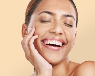 Close up of a smiling woman representing the free skin assessment at Chapter Aesthetic Studio.