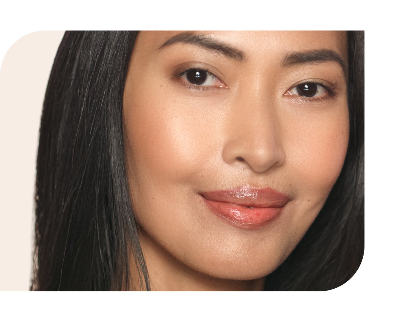 A woman with natural makeup and glowing skin