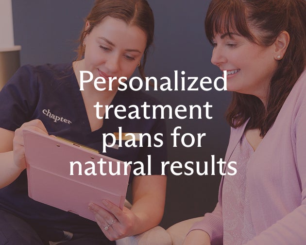 A professional and client discuss personalized treatment plans for natural results