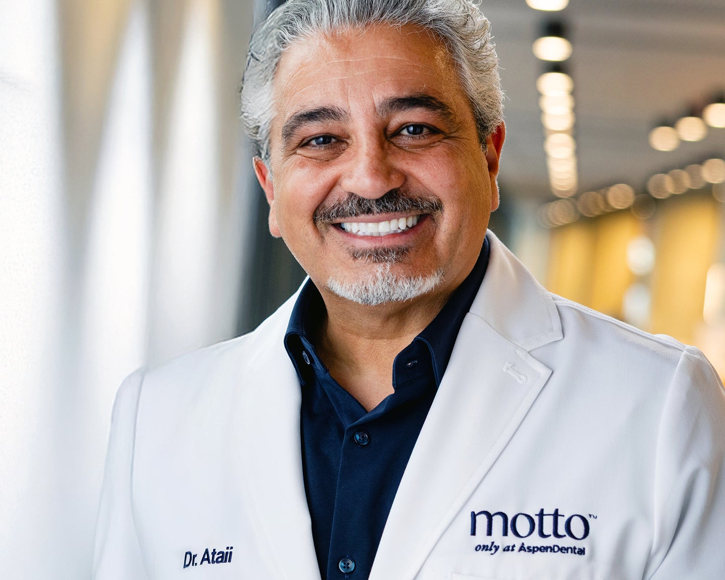 Portrait of Dr. Payam Ataii smiling, representing clinical leadership and support for clear aligner treatment with Motto