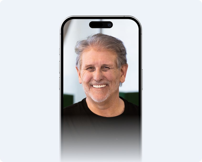 The final result of the Smile Preview application, with the man's custom smile displayed on screen.