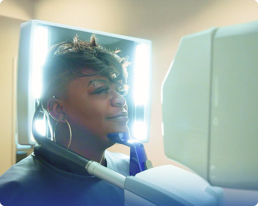 A ClearChoice patient undergoing a 3D dental imaging scan, used to plan precise and personalized dental implant treatment.