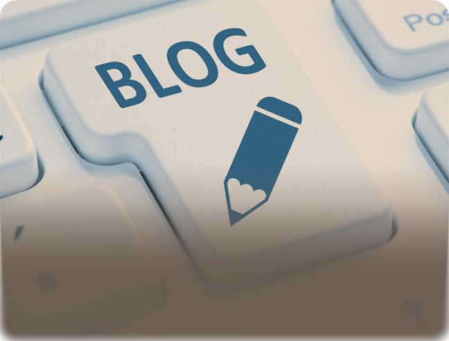 Keyboard key labeled “BLOG” with text “Expert tips &amp; articles – Read our blog” promoting ClearChoice dental implant blog and educational resources.