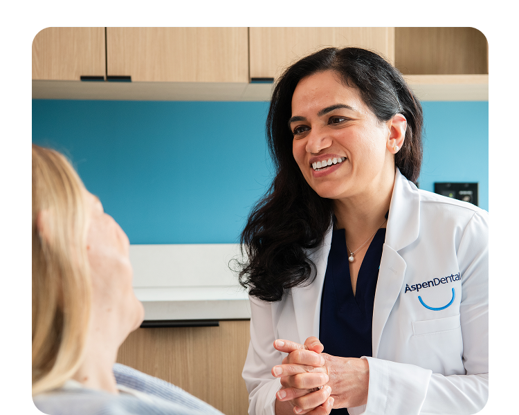 Aspen Dental provider speaking with a patient.