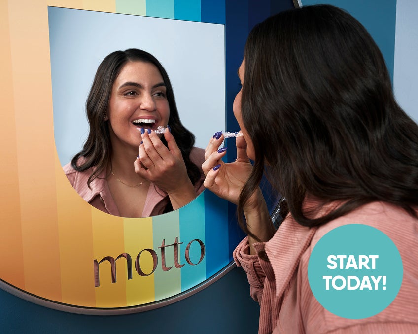  A woman is trying on her Motto clear aligners in front of a mirror. We see a circle with START TODAY! in the corner of the visual.