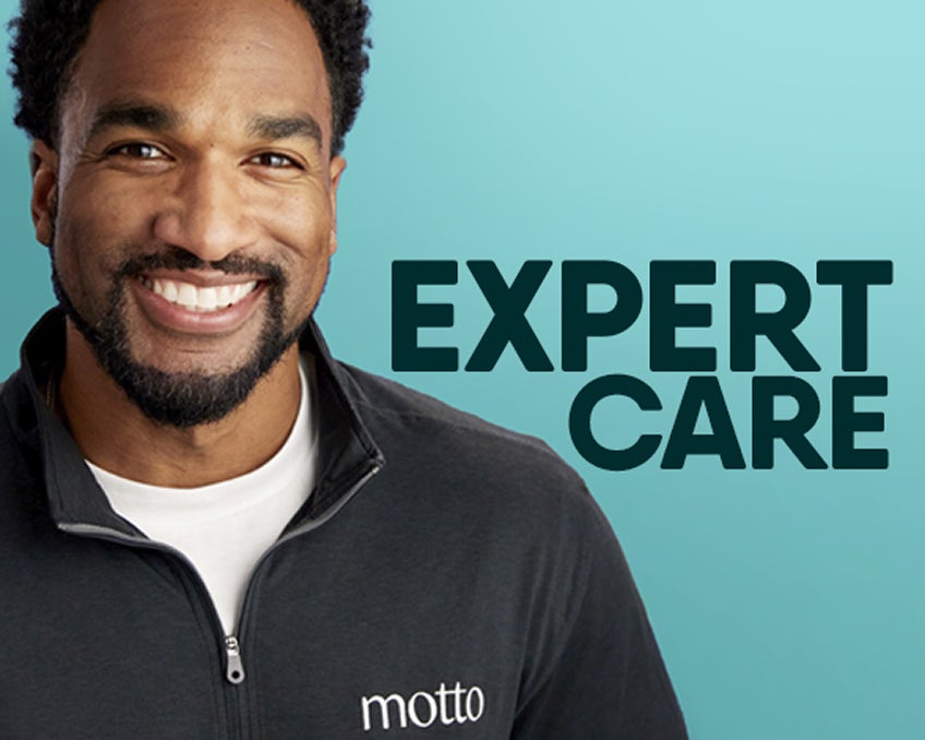 Smiling man representing expert care and doctor support throughout clear aligner treatment with Motto