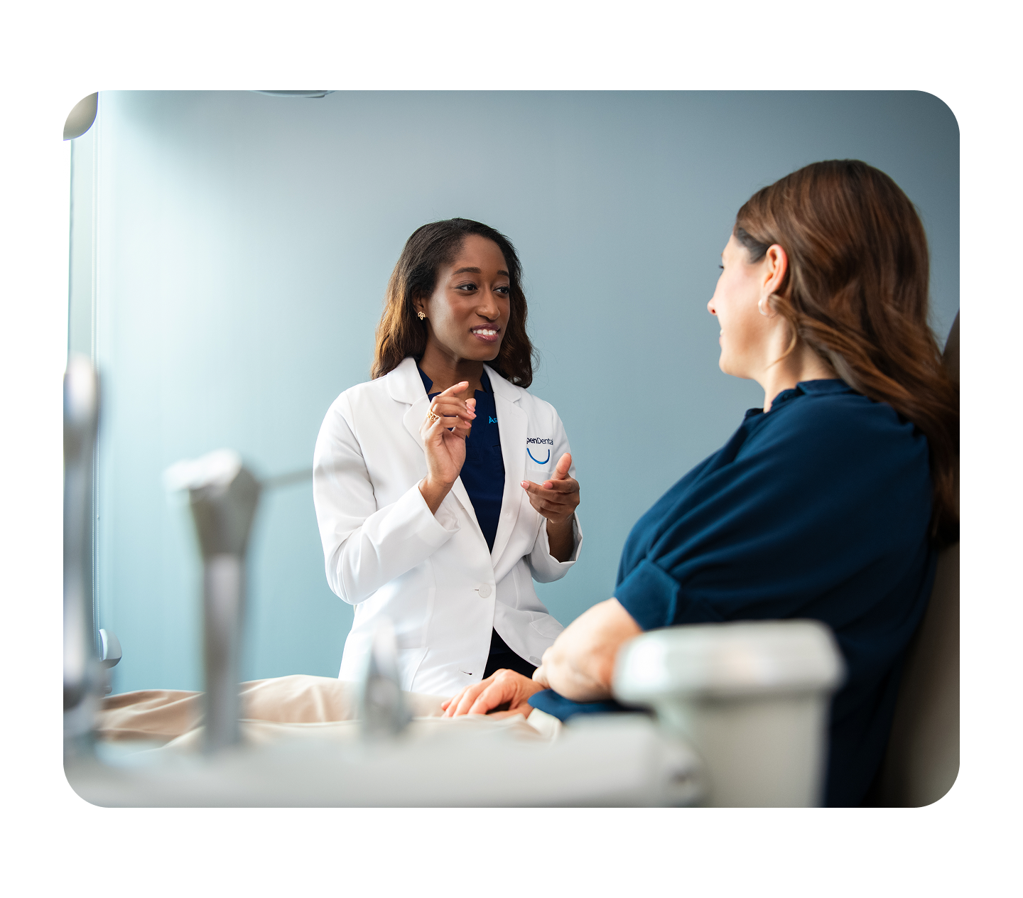 A healthcare professional consults with a patient