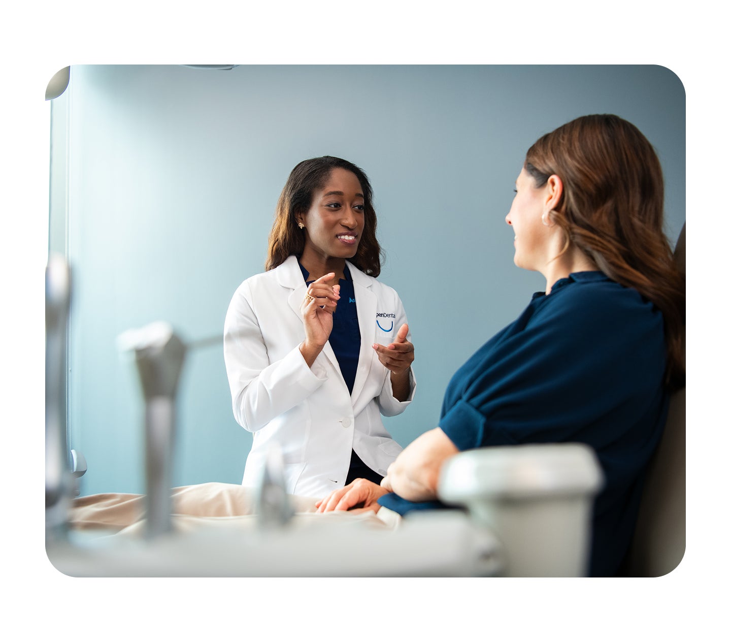 A healthcare professional consults with a patient