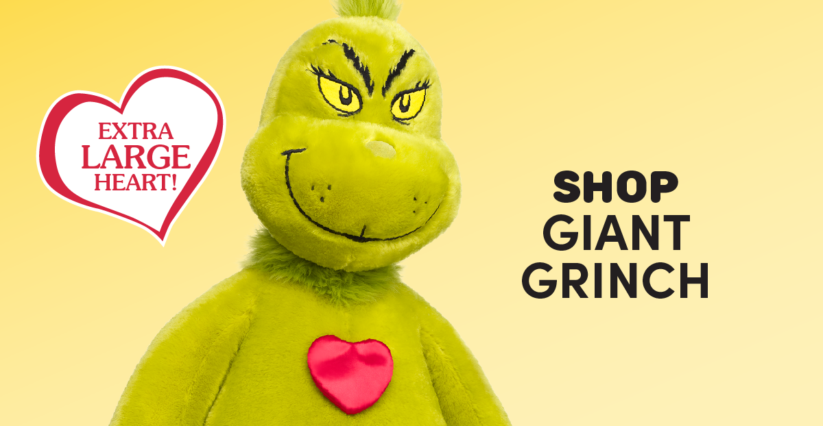 Holiday-themed email featuring a family gathered around a book with Build-A-Bear The Grinch plush characters and Max the dog plush beside them. The Grinch logo appears above the headline TIS THE SEASON TO BE GRINCHY, followed by the text Even the grouchiest names on your list will love these Grinch gifts! and a red SHOP NOW button. Below, product sections showcase a Grinch plush in a Santa outfit with the text SHOP GRINCH and an Extra Large Heart badge, Max the dog plush with SHOP MAX, a Giant Grinch plush with an Extra Large Heart badge and SHOP GIANT GRINCH, and a teddy bear wearing Grinch-print pajamas with SHOP GRINCHY FASHIONS. A red
 SHOP COLLECTION button appears at the bottom.
