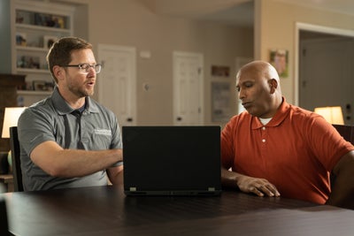 Foundation Recovery Systems inspector meeting with a homeowner