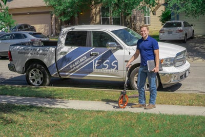 FSS inspector in front of work truck