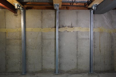 IntelliBrace⢠beams installed on basement wall