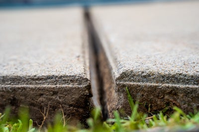 Uneven concrete needing repair.