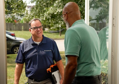 Groundworks inspector meeting with a homeowner