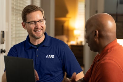 AFS inspector meeting with a homeowner