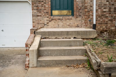 Cracking steps at the front of a home.