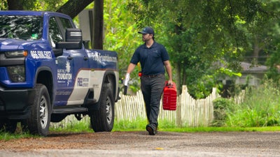 MVFS inspector inspecting a home for damage.