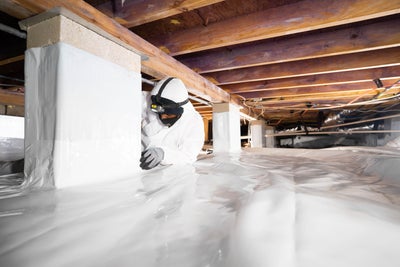 Crew installing a vapor barrier.