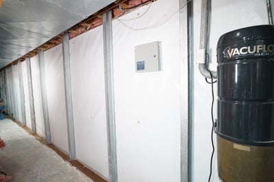 foundation crack repair Wall braces installed to stabilize basement walls.
