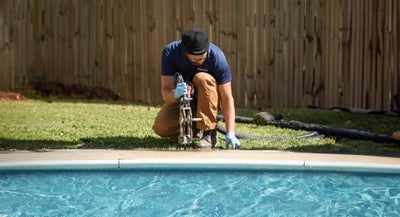FSS employee working to repair pool deck
