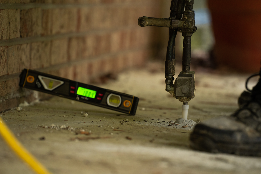 Groundworks tech repairing pool deck concrete