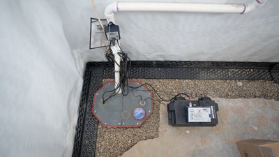 installed basement interior drainage and sump pump with an airtight lid