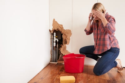 Homeowner dealing with broken pipes