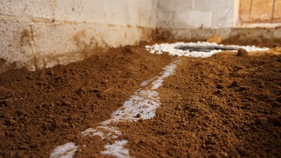 Close up of a dirty crawl space.