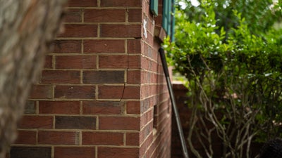 hairline cracks in brick wall exterior