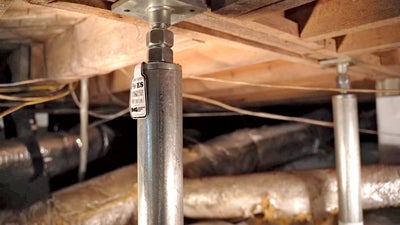 crawl space jacks installed in a crawl space