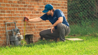 Groundworks crewman inspecting a foundation.