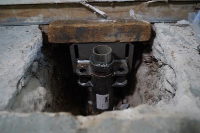 Push pier connected to a foundation.