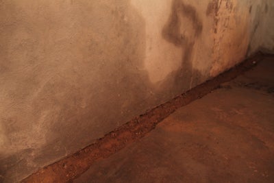 Water stains on a wet basement wall.