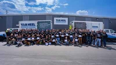 Tar Heel Basement Systems work trucks and crew members