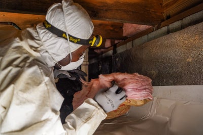Groundworks employee working in a crawl space
