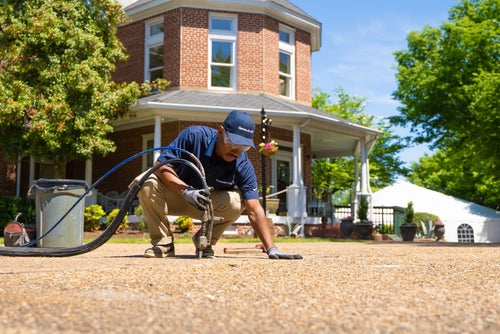 A Groundworks worker installing PolyRenewal.