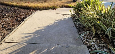 cracking and sinking sidewalk