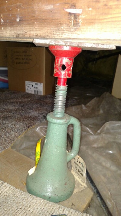 bottle jack installed in a crawl space