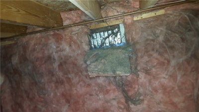 Open vent in a crawl space.